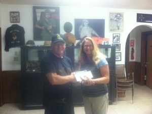 VET Inc receiving donation from Uptown owner Beth Tedio